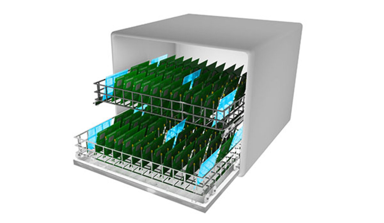 Printed circuit boards are placed in the baskets of the batch cleaning system and ready for the next cleaning process.  | © Zestron