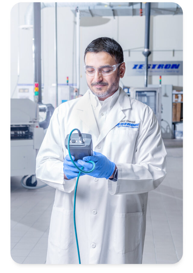 Syed Ahamd, M.S. holding a zestron eye mobile in his hands 