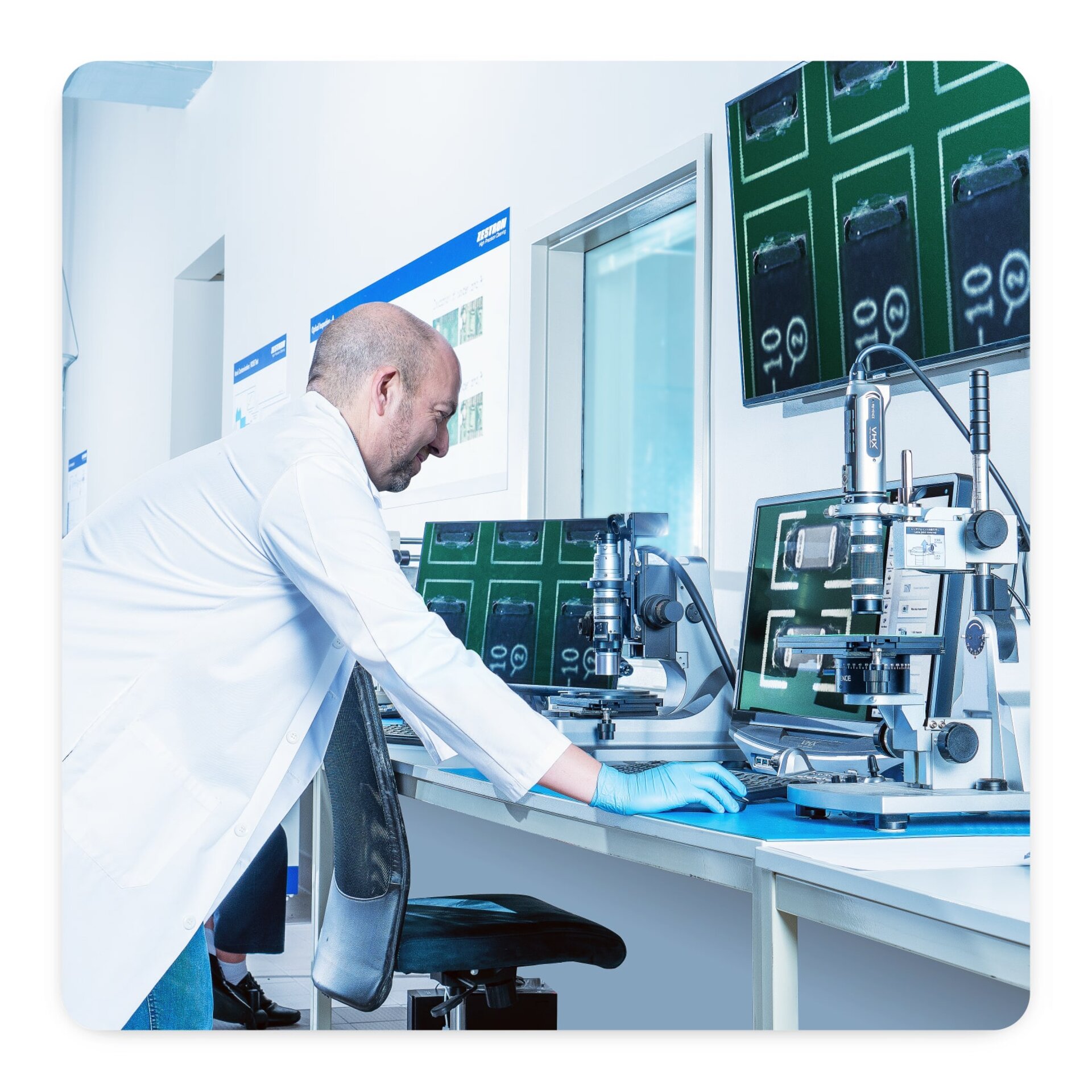 Denis Barbini - Technical Solutions Manager at Zestron US looking at flux on a visual inspection microscope 