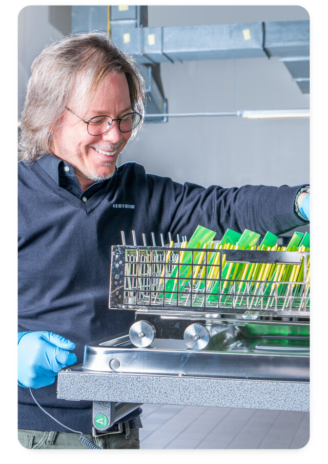 Axel Vargas Eastern USA  Regional Sales Manager using batch machine to clean pcb 