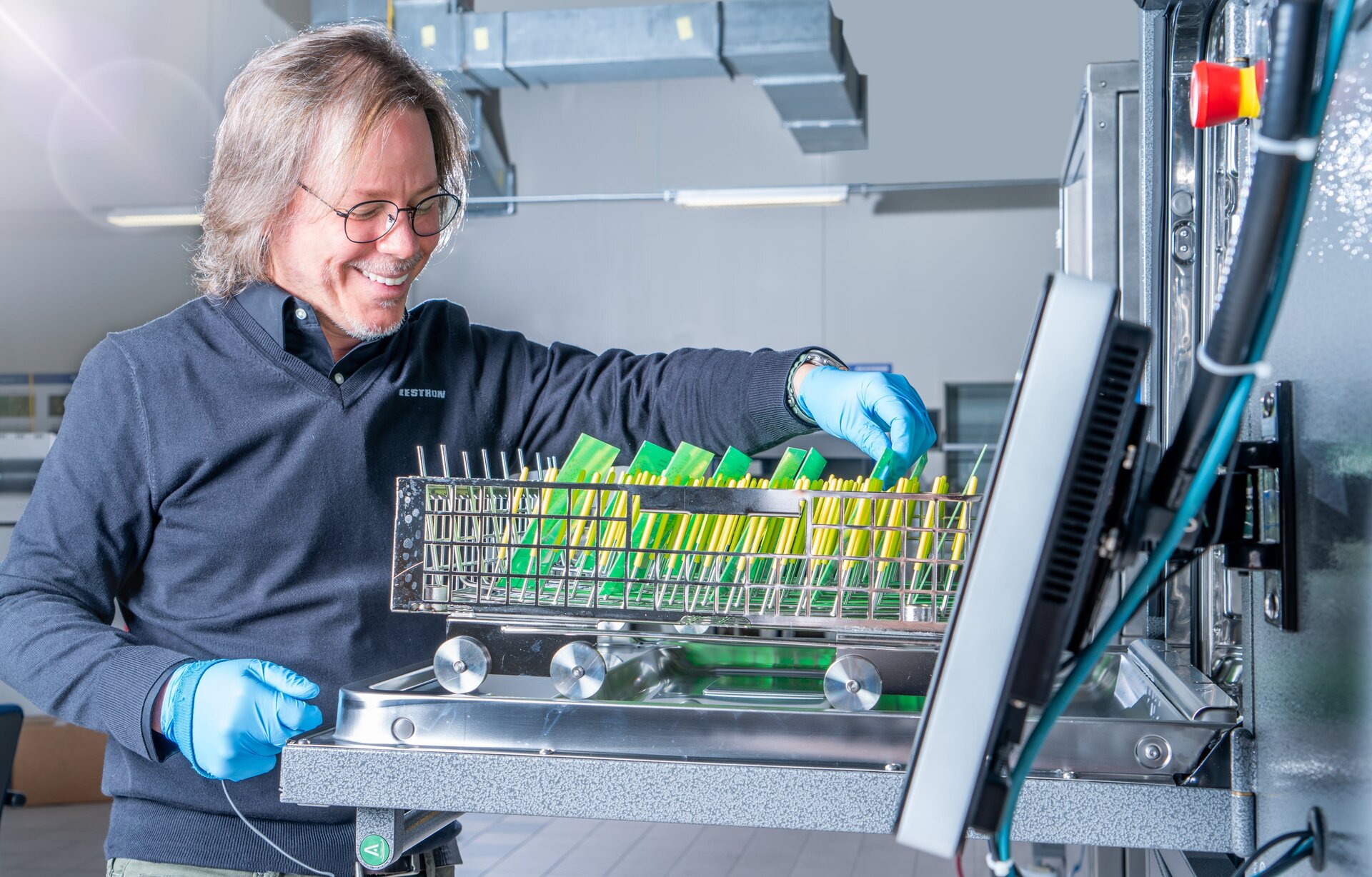 Axel Vargas Eastern USA  Regional Sales Manager using batch machine to clean pcb 