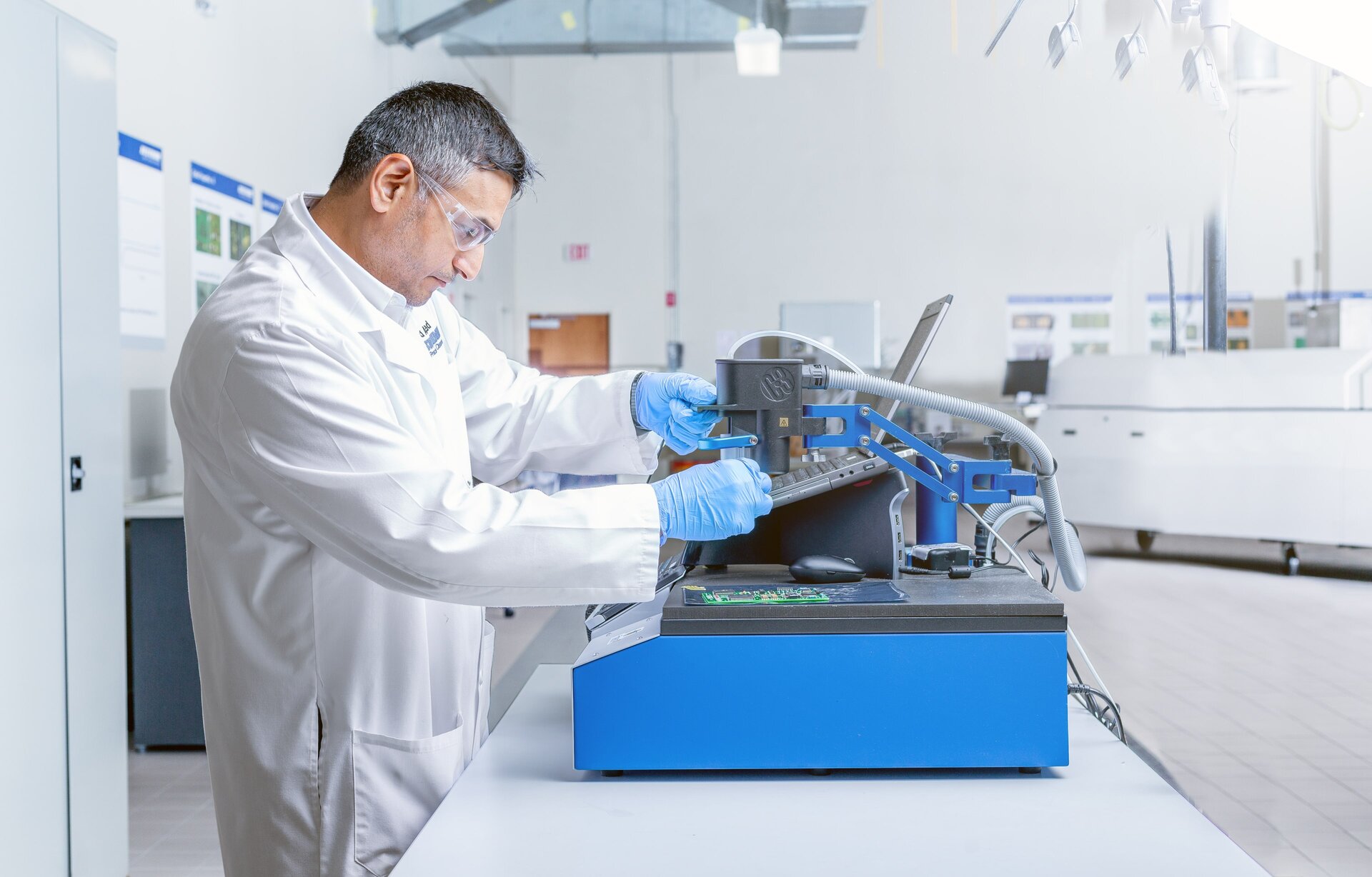 engineer using the c3 machine to test a pcb using ion chromatography 